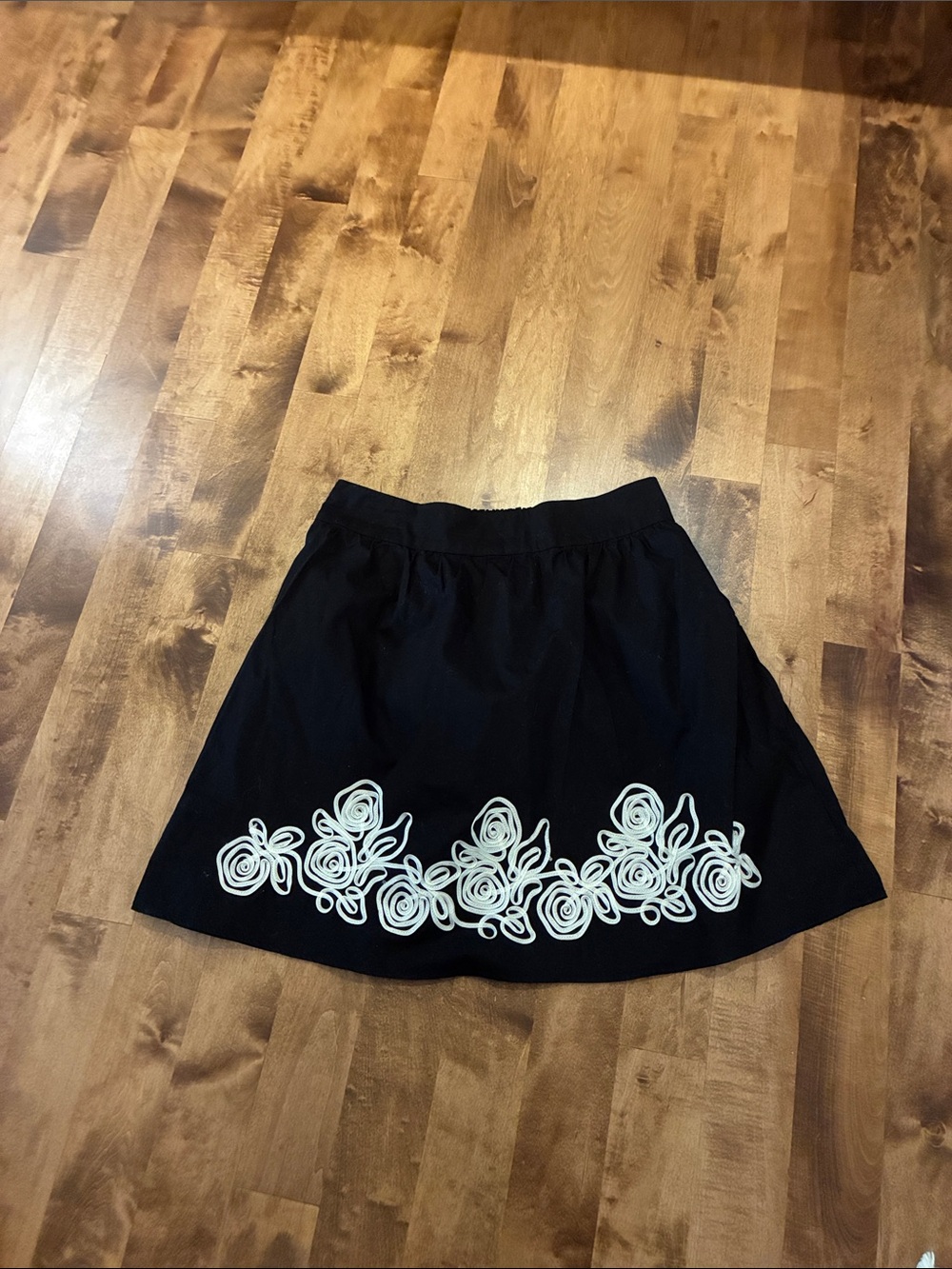 Wrapper Black Skirt with White Rosette Border